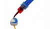 Fig 10. Cleaning intaglio surface of a lithium disilicate crown with 37% phosphoric acid.