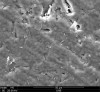 Fig 13. Surface of lithium disilicate after sandblasting with glass with etch pattern dulled (compare with Figure 2).